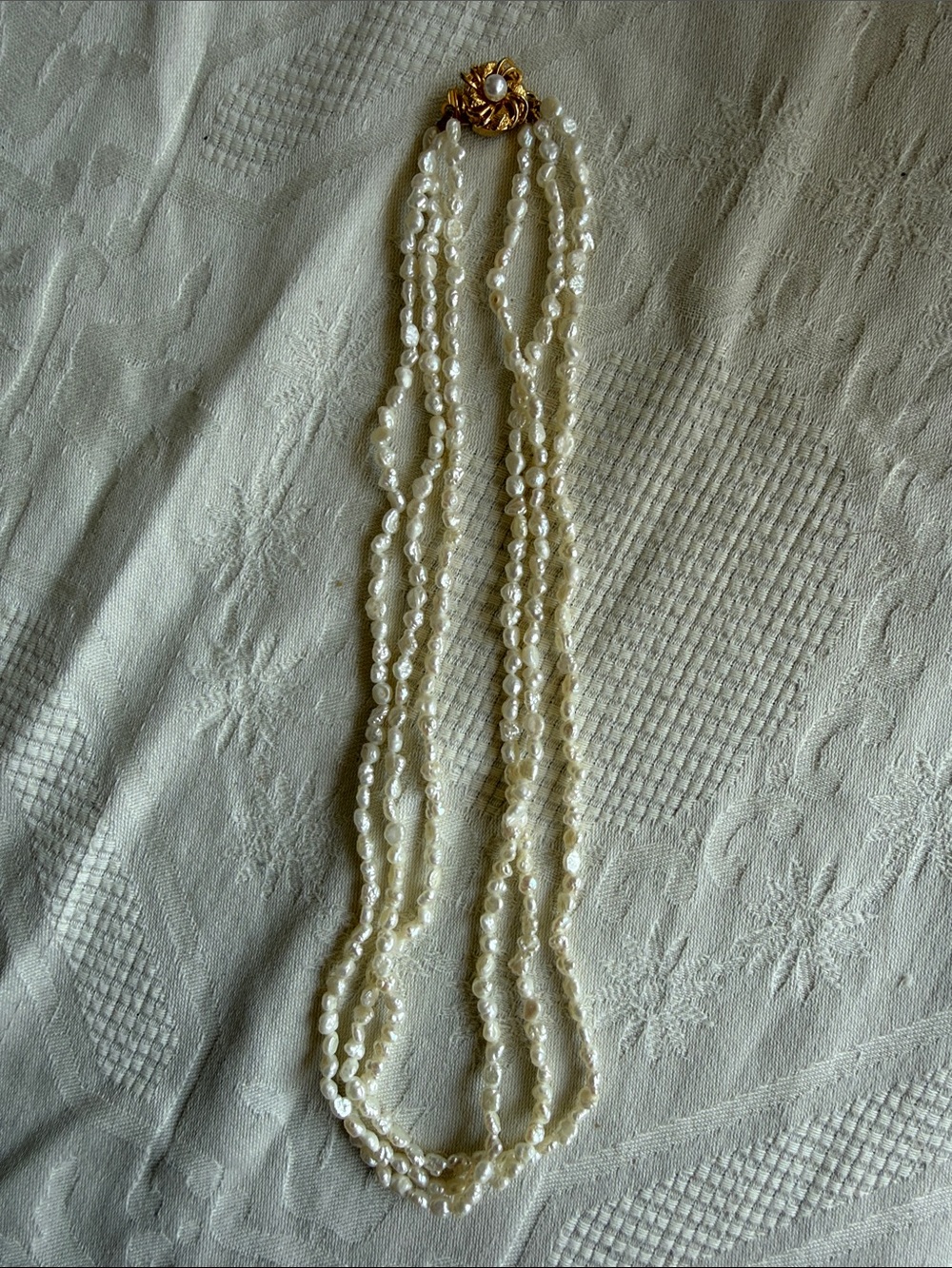 Multi-Strand Cream Seed Pearl Necklace with Gold Accent